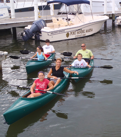 Family renting kayaks at Port Sanibel Marina, Fort Myers, Florida