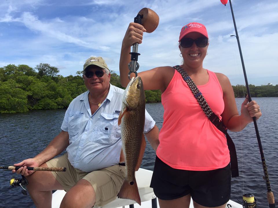 Couple catches redfish with Endless Summer Charters on Sanibel Island.