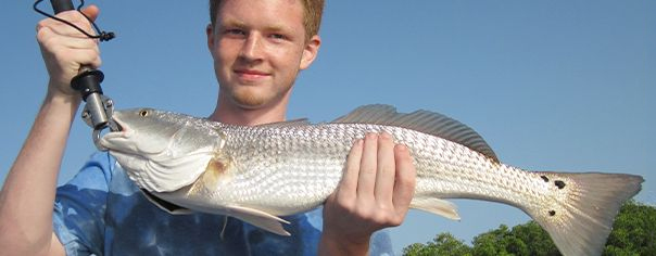 port-sanibel-marina-redfish-fisherman